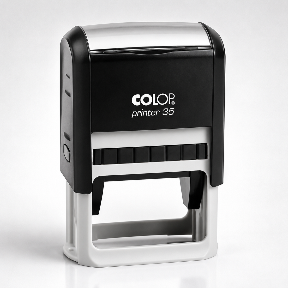 A COLOP Printer 35 self-inking stamp with a black and silver body, shown on a clean white background.